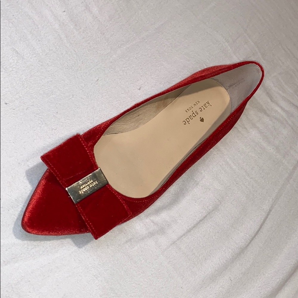 Orange/red flats with gold hardware and bow